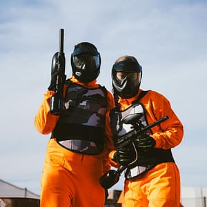 Group of players in black paintball gear posing at Volcano Experience paintball field in Marrakech"